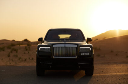 A front view of a Rolls Royce, showcasing its bold grille and premium design, available for car lease in UAE.