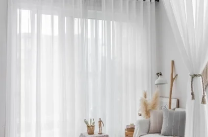 A white sheer curtain hangs in a modern living room
